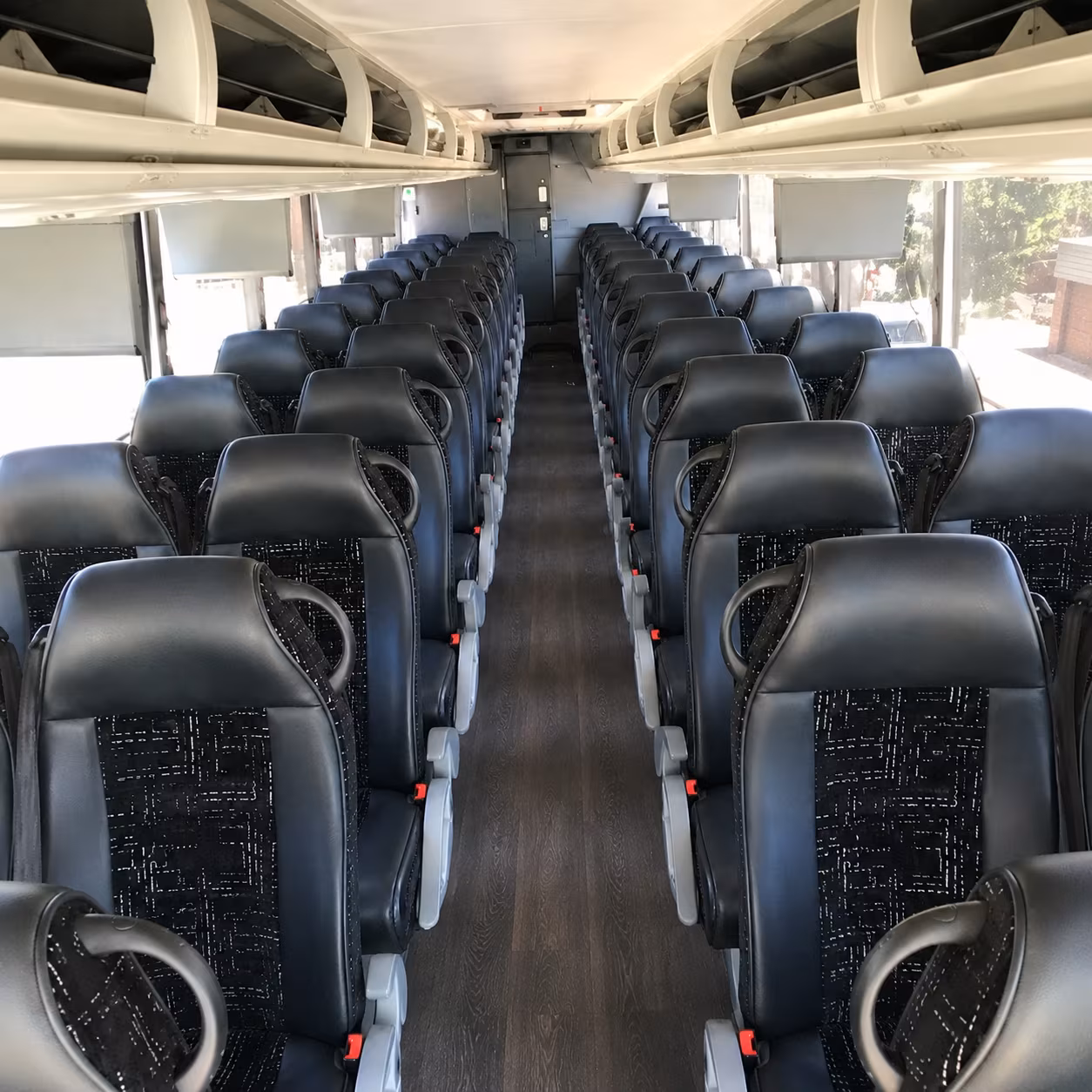 charter bus shuttle service for lawrence manufacturing and warehouse groups